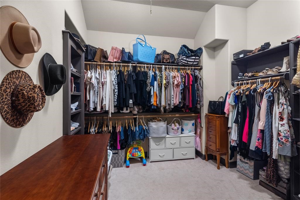 607 28th Street San Leon, TX 77539 - Photo 36 of 44 a view of walk in closet with clothes and shoes