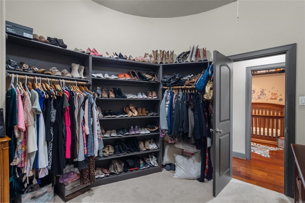 607 28th Street San Leon, TX 77539 - Photo 37 of 44 a view of walk in closet with clothes and shoes