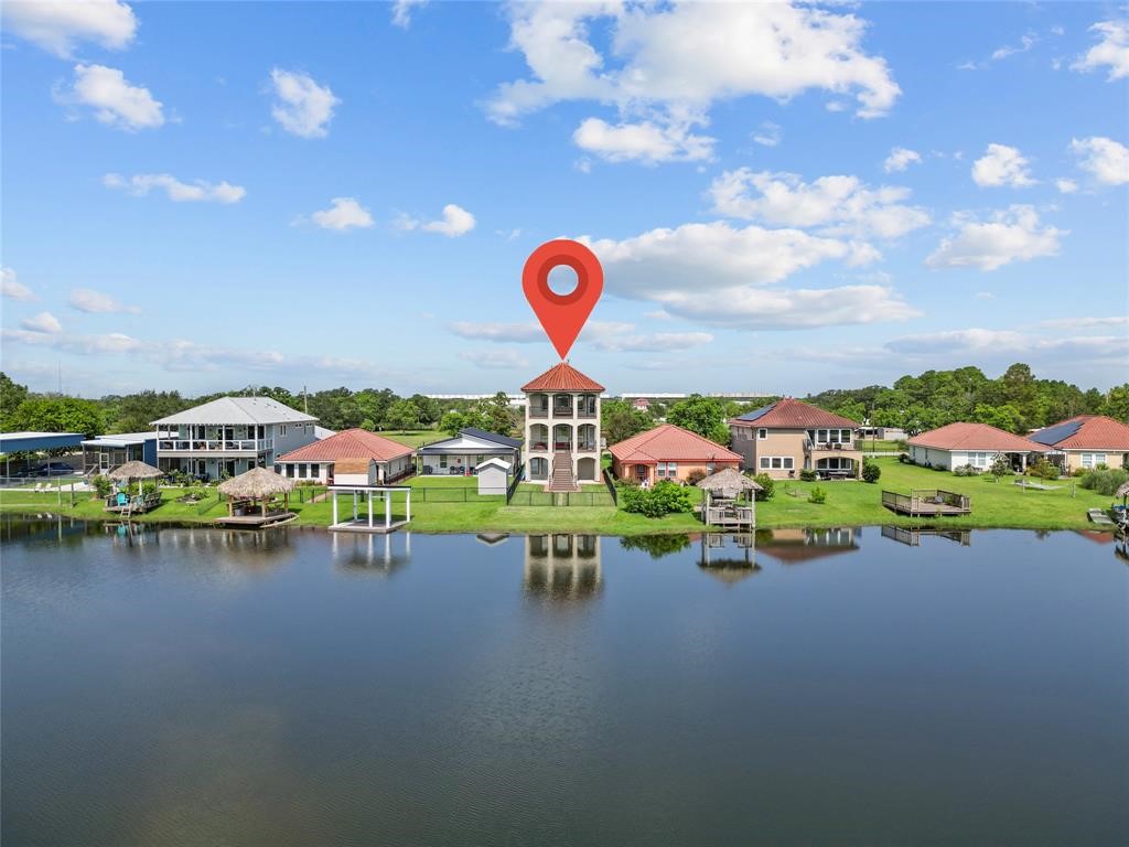 607 28th Street San Leon, TX 77539 - Photo 4 of 44 a view of a lake with a building in the background