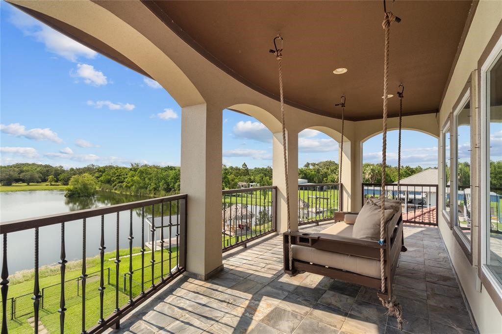 607 28th Street San Leon, TX 77539 - Photo 41 of 44 a view of a chairs and table in patio with a lake view