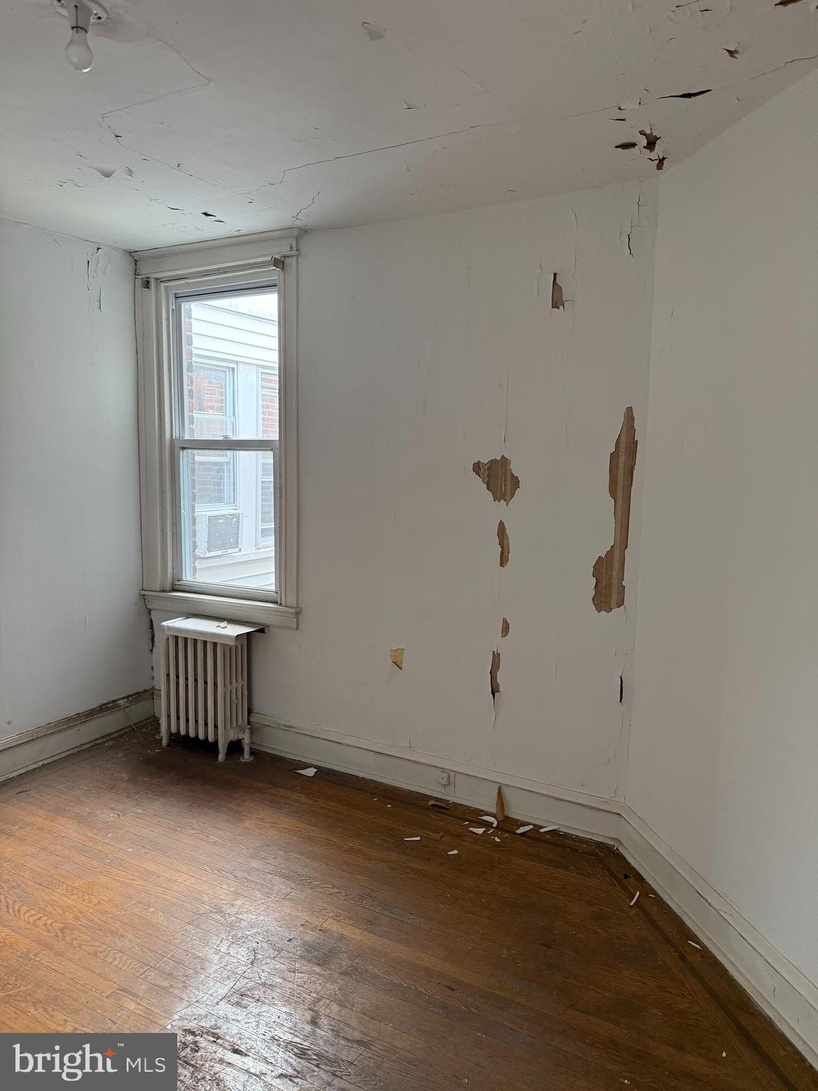 6726 Wyncote Avenue Philadelphia, PA 19138 - Photo 5 of 35 a view of an empty room with a window