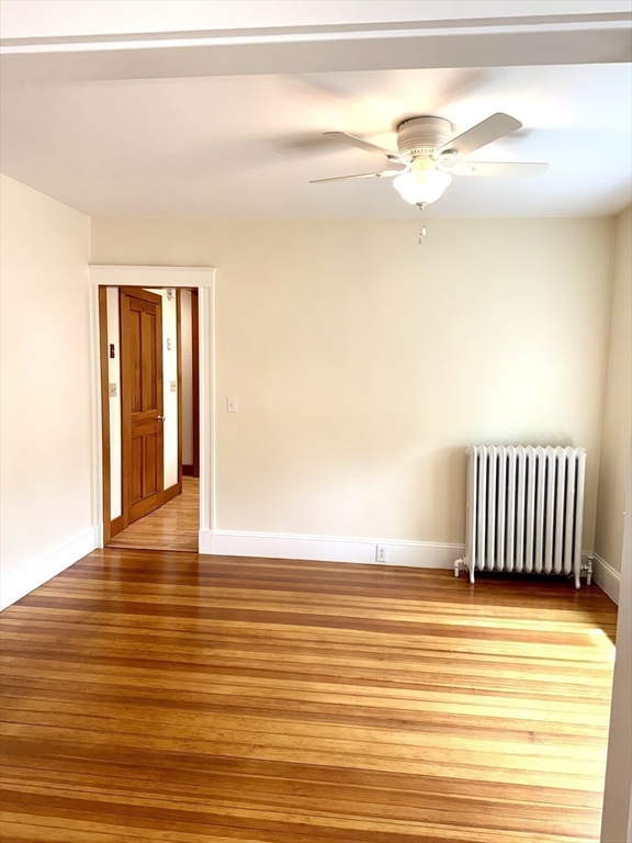 39 Newman Road Malden, MA 02148 - Photo 6 of 27 a view of a room with wooden floor and a floor to ceiling window
