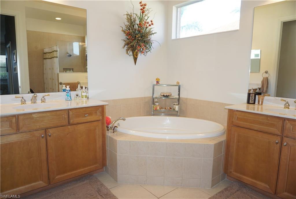 6189 Bunker Place Naples, FL 34113 - Photo 11 of 25 a utility room with dryer and washer
