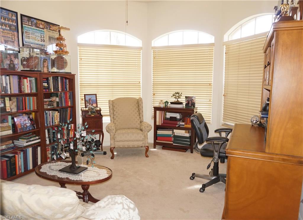 6189 Bunker Place Naples, FL 34113 - Photo 13 of 25 a view of a workspace with furniture and a window