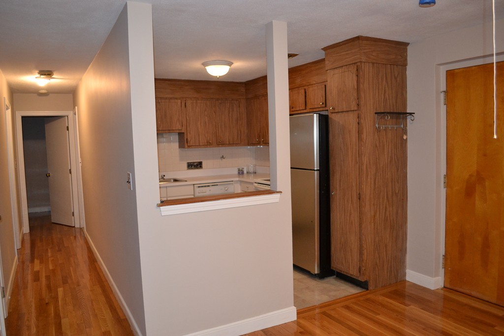 100 Summer Street, Unit 14 Watertown, MA 02472 - Photo 5 of 9 a kitchen with a refrigerator a sink and dishwasher