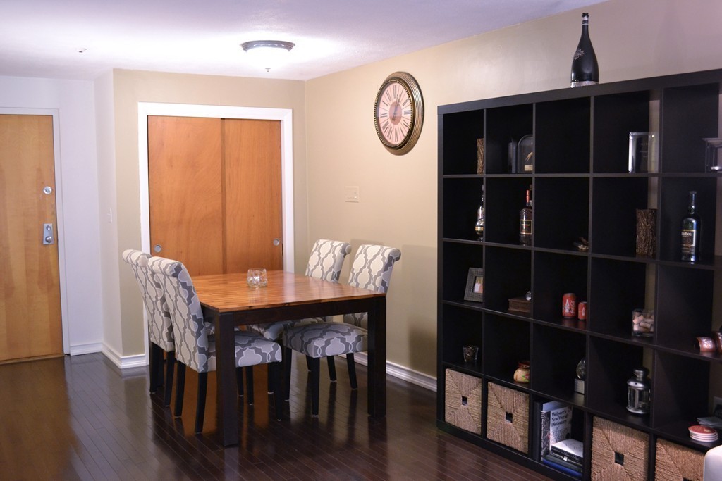 100 Summer Street, Unit 14 Watertown, MA 02472 - Photo 7 of 9 a view of a dining room with furniture and wooden floor