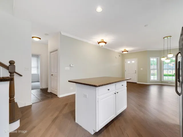 a view of a kitchen cabinets and a wooden floor