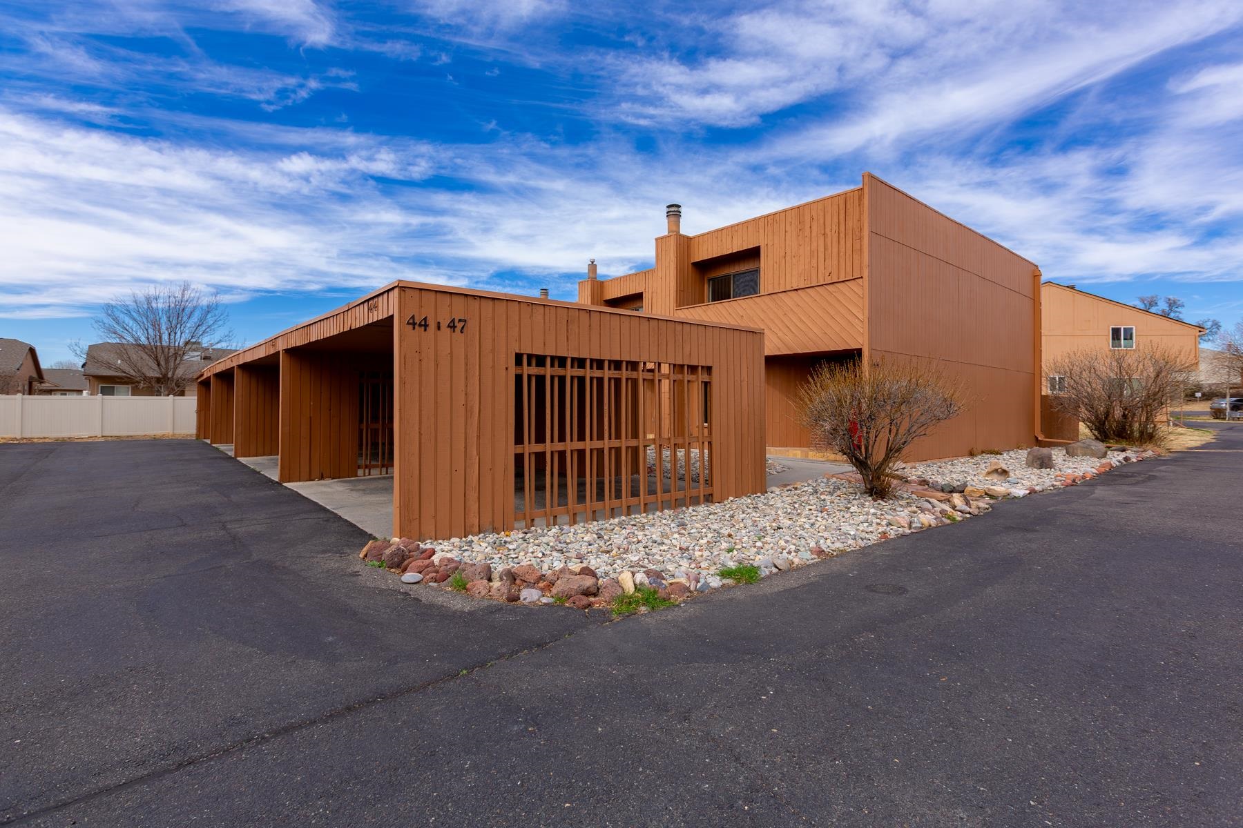 575-28 28 1/2 Road, Unit 44 Grand Junction, CO 81501 - Photo 31 of 39 a view of a house with wooden fence
