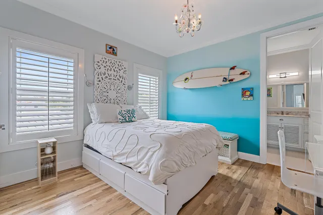 a bathroom with a granite countertop sink a toilet and a mirror