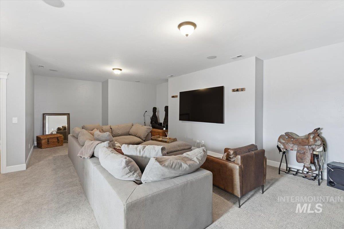 8982 New Castle Drive Middleton, ID 83644 - Photo 28 of 48 Carpeted living area featuring baseboards