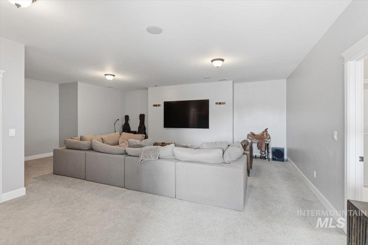 8982 New Castle Drive Middleton, ID 83644 - Photo 29 of 48 Living room with light carpet and baseboards