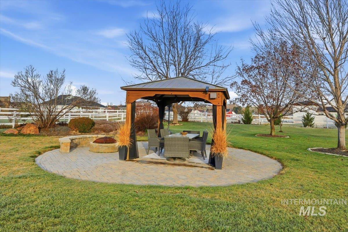 8982 New Castle Drive Middleton, ID 83644 - Photo 38 of 48 Fenced backyard with a patio area, a gazebo, and a fire pit