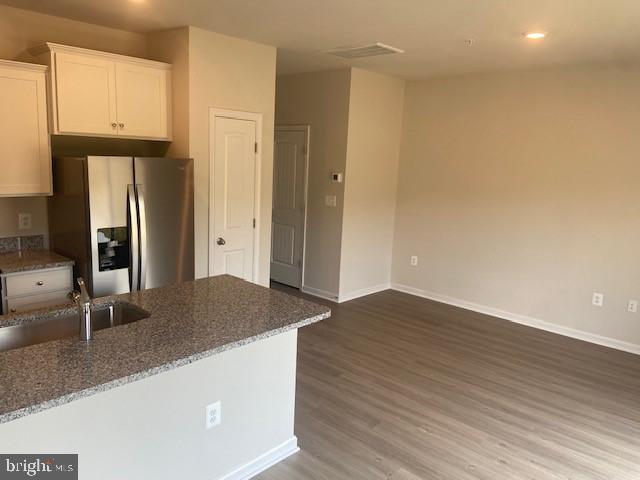 8159 Bartholomew Court Baltimore, MD 21206 - Photo 9 of 18 Kitchen & Living Room