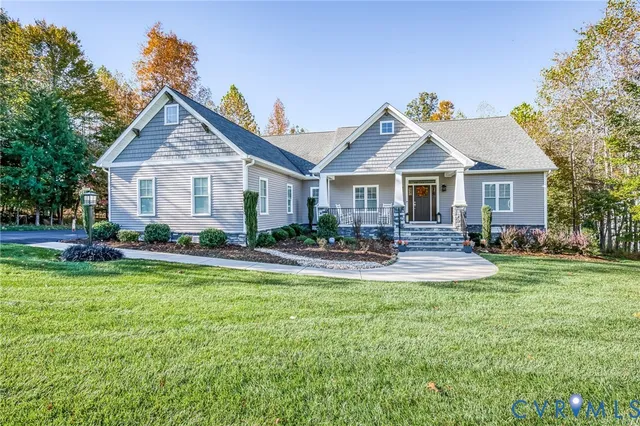 a front view of a house with swimming pool having outdoor seating