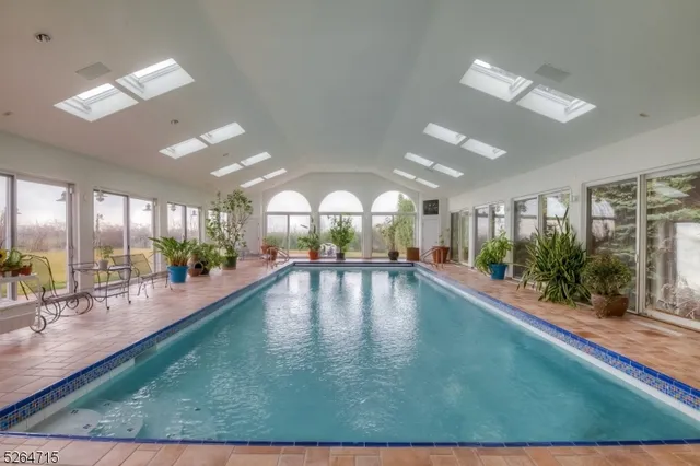 a view of swimming pool with outdoor seating