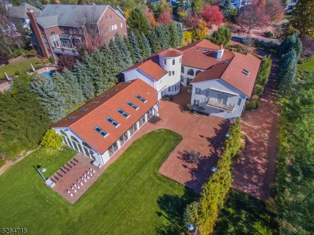 an aerial view of a house with a garden