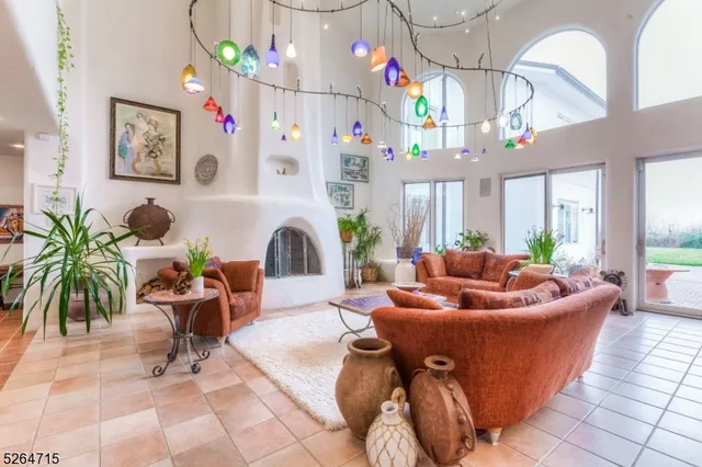 a living room with furniture and a chandelier