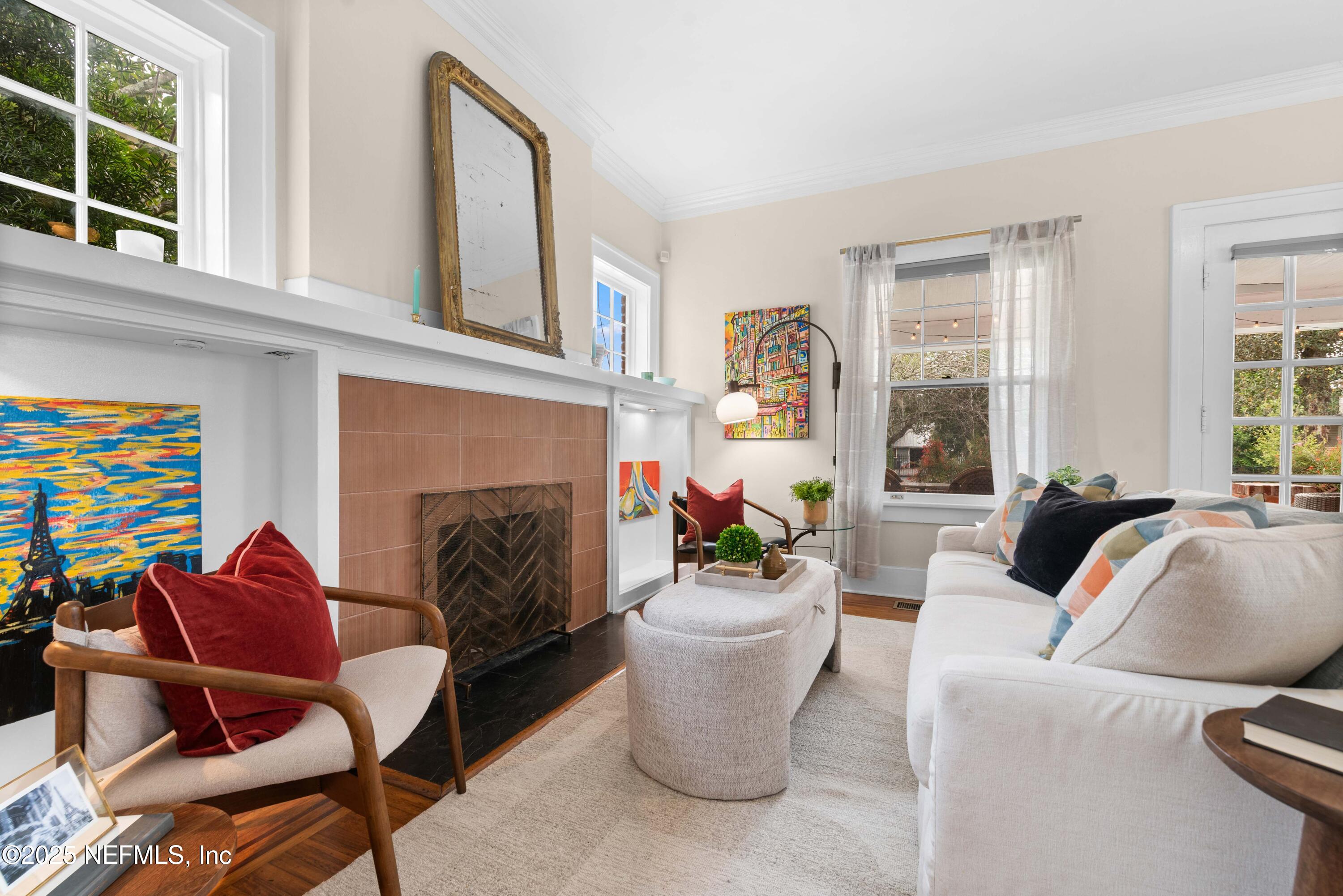 3023 Oak Street Jacksonville, FL 32205 - Photo 12 of 50 a living room with furniture a fireplace and a window