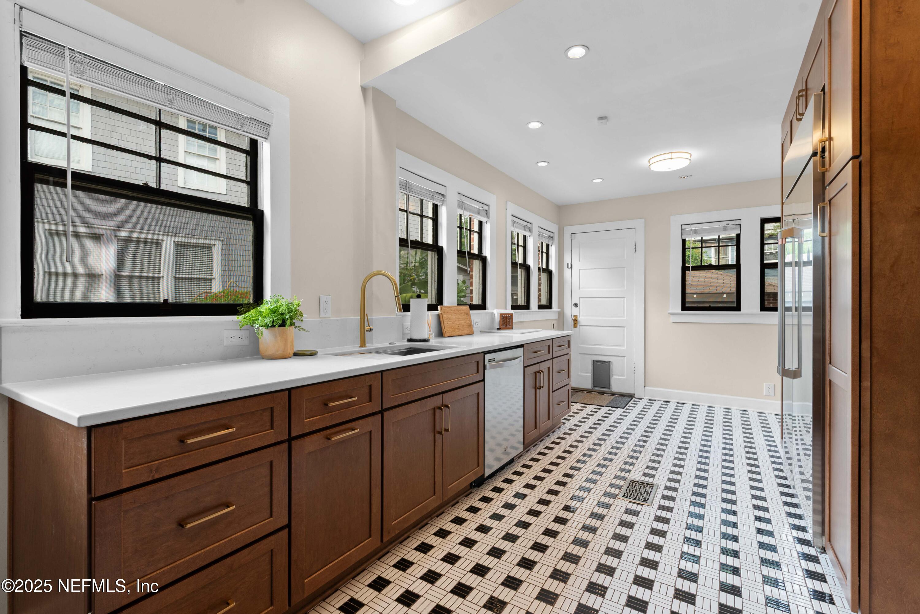 3023 Oak Street Jacksonville, FL 32205 - Photo 23 of 50 a large bathroom with a double vanity sink a mirror and a shower