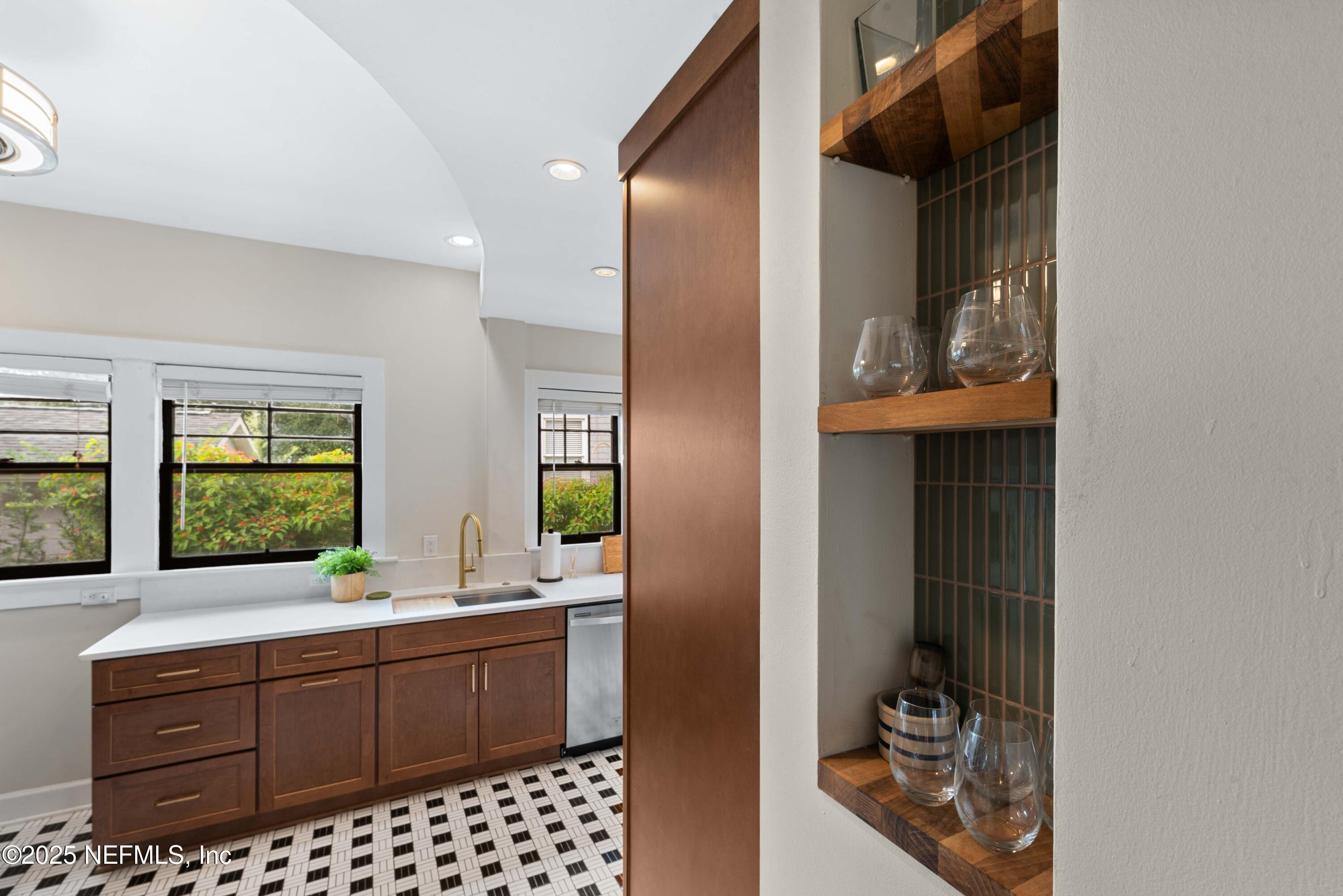 3023 Oak Street Jacksonville, FL 32205 - Photo 24 of 50 a bathroom with a sink a mirror and a toilet