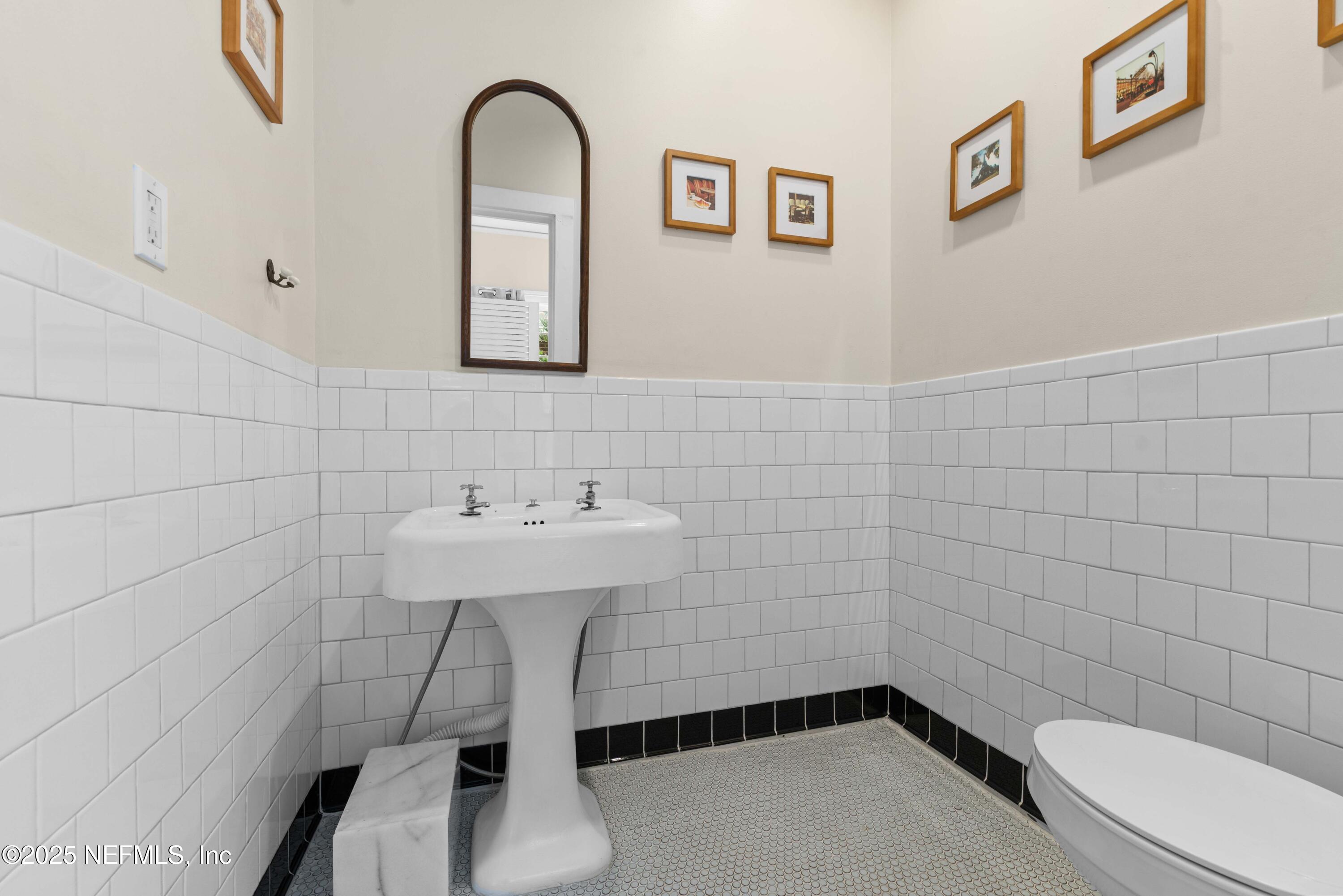 3023 Oak Street Jacksonville, FL 32205 - Photo 26 of 50 a bathroom with a sink a toilet and shower