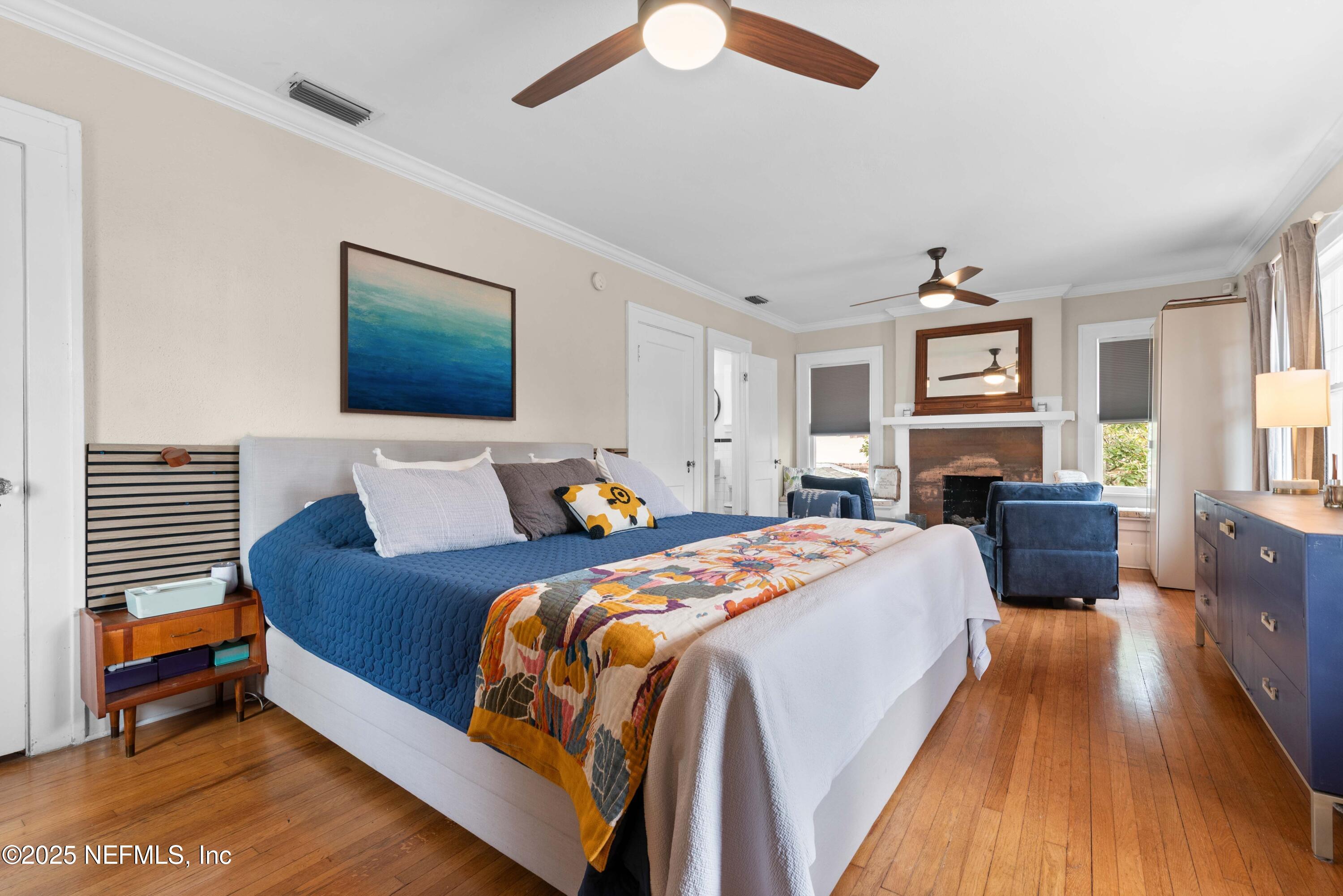 3023 Oak Street Jacksonville, FL 32205 - Photo 30 of 50 a bedroom with bed and a chandelier