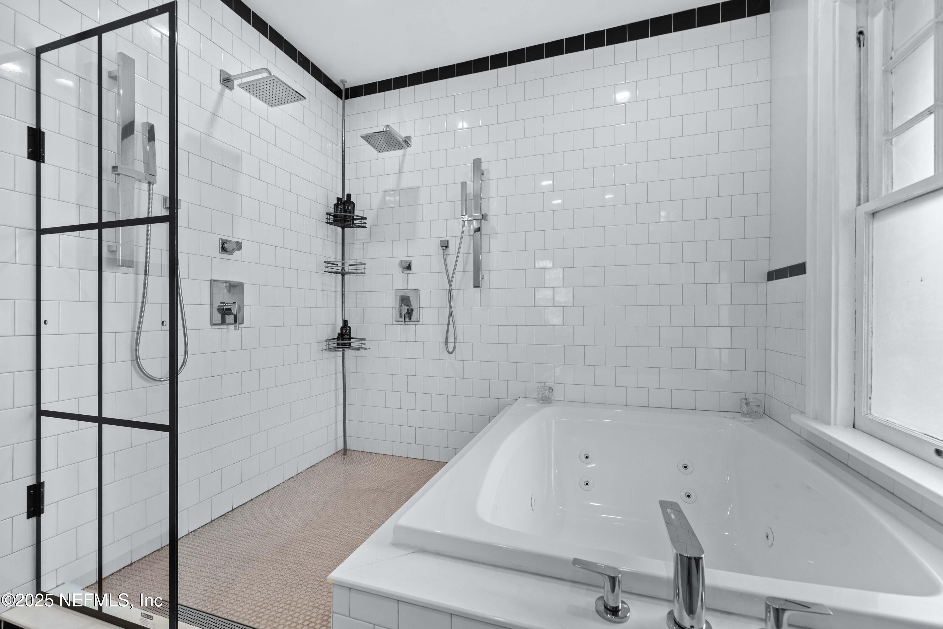 3023 Oak Street Jacksonville, FL 32205 - Photo 33 of 50 a bathroom with a bathtub and a shower