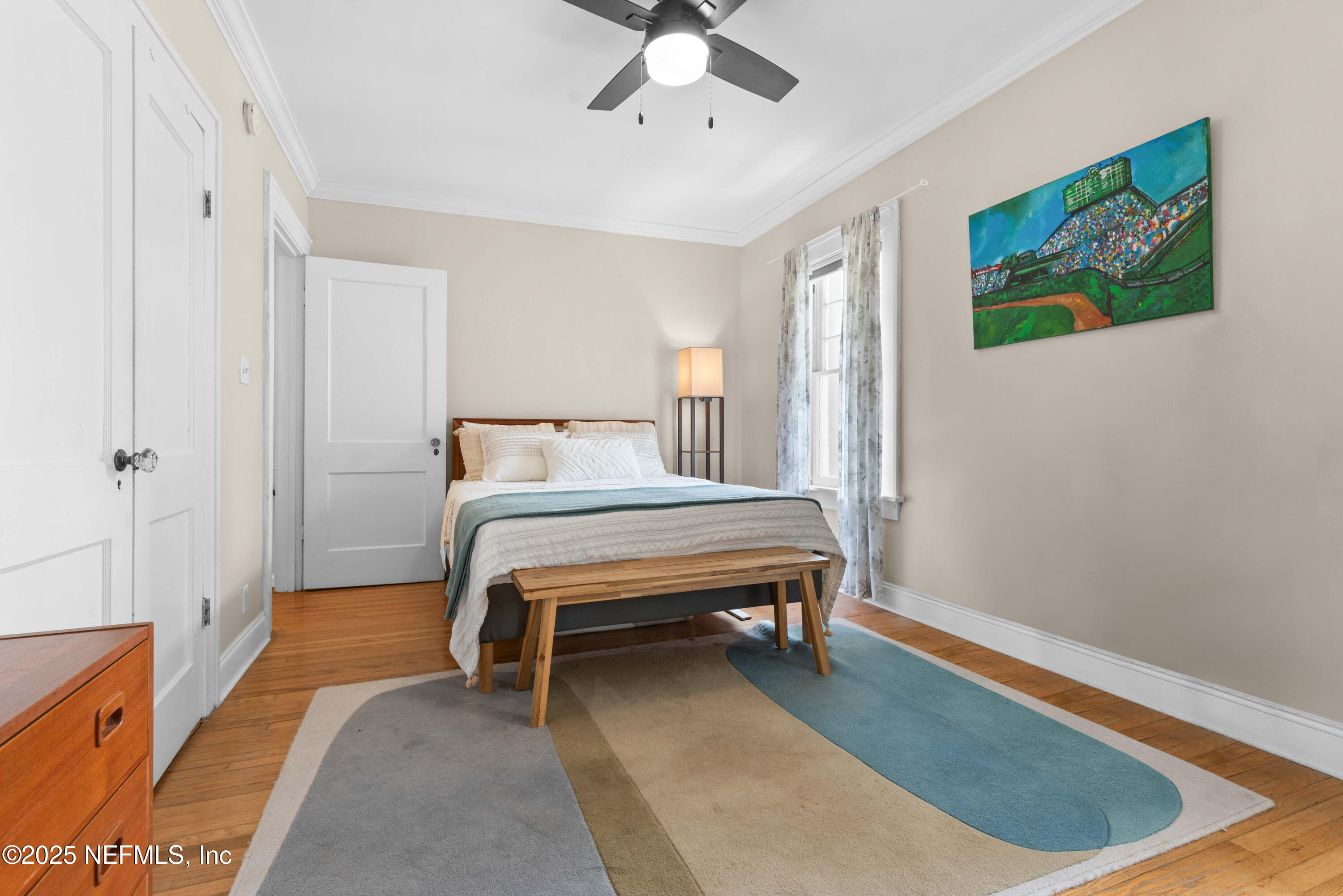 3023 Oak Street Jacksonville, FL 32205 - Photo 37 of 50 a bedroom with a bed and wooden floor