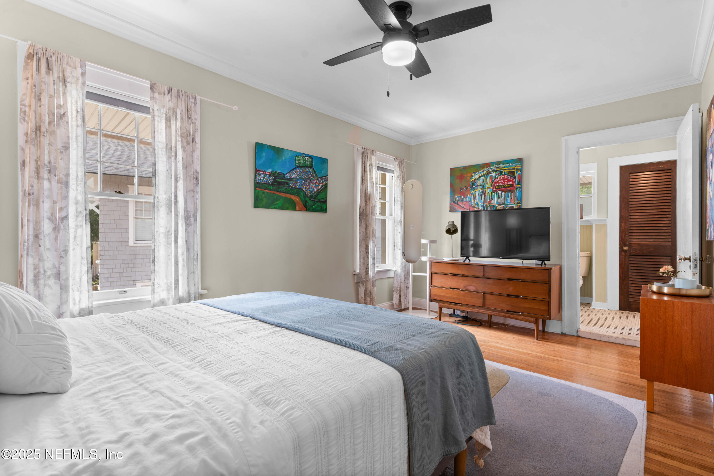 3023 Oak Street Jacksonville, FL 32205 - Photo 38 of 50 a bedroom with a bed and wooden floor