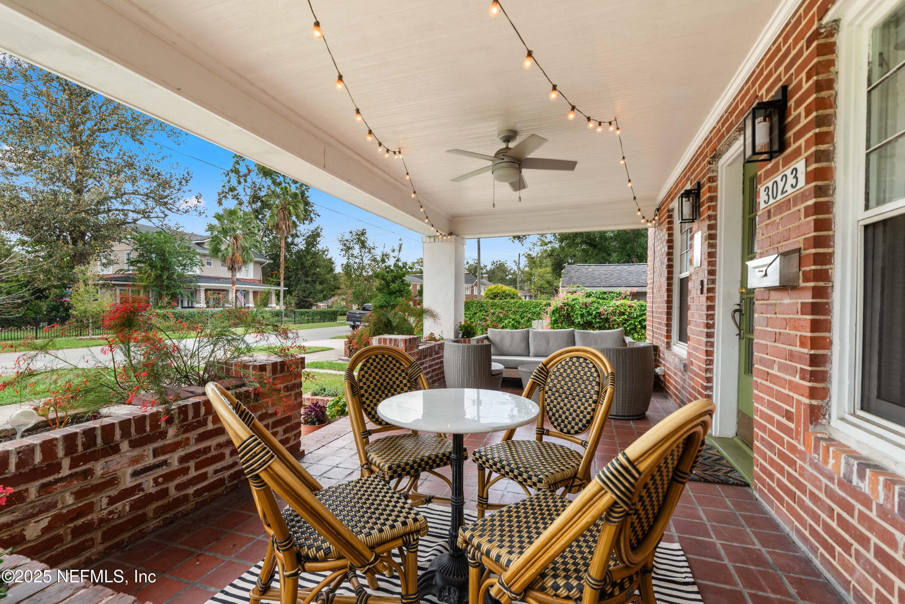 3023 Oak Street Jacksonville, FL 32205 - Photo 5 of 50 a view of a patio with a dining table and chairs