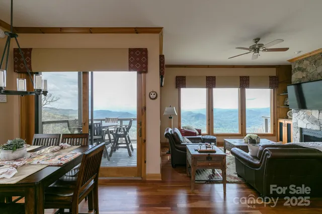a living room with furniture and large windows