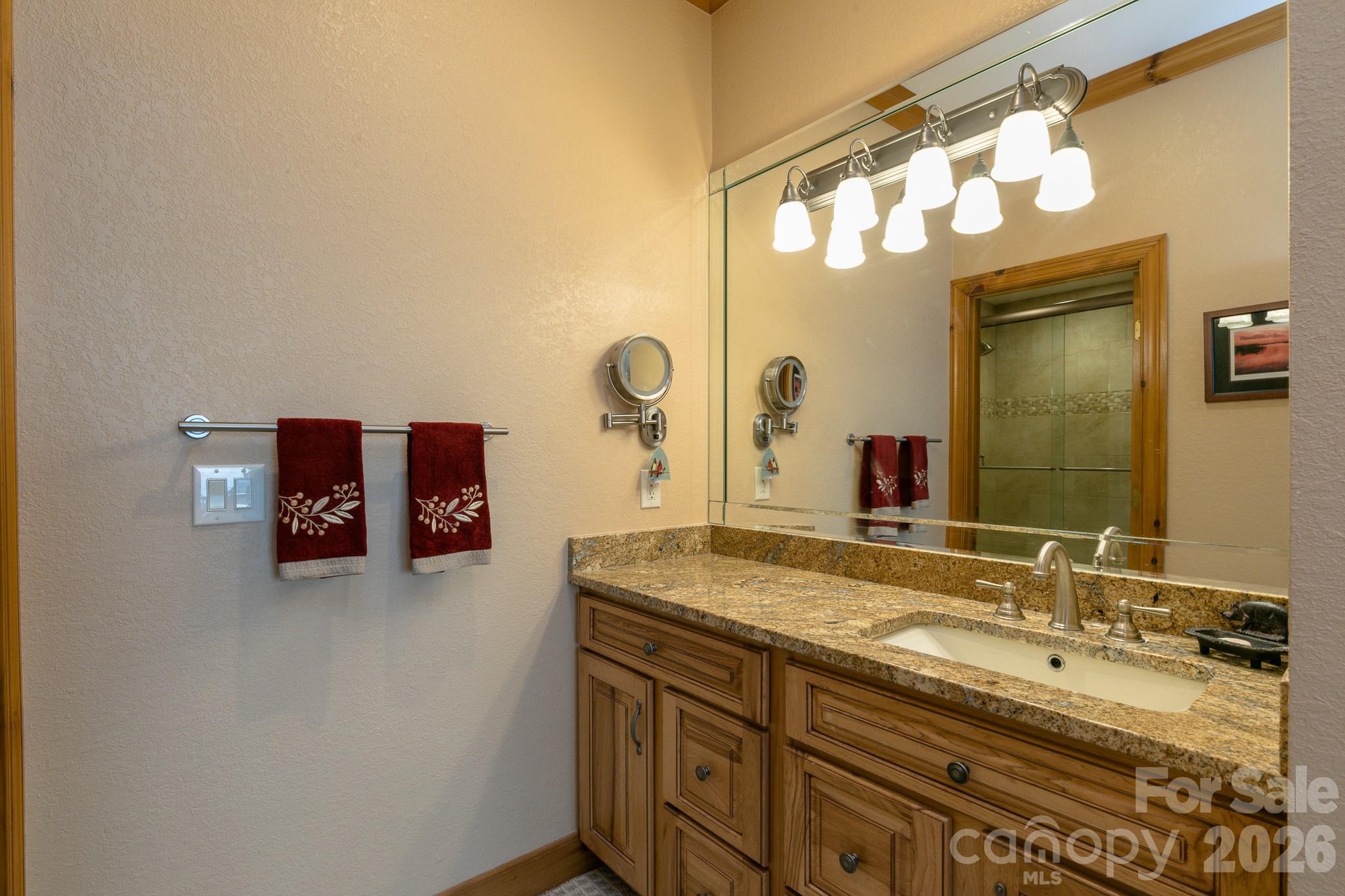 140 Slickrock Road, Unit F3 Burnsville, NC 28714 - Photo 21 of 31 a bathroom with a sink double vanity and a mirror