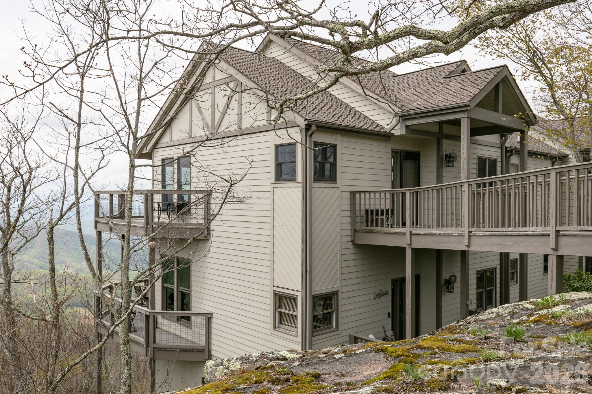 140 Slickrock Road, Unit F3 Burnsville, NC 28714 - Photo 26 of 31 a view of a house with a yard