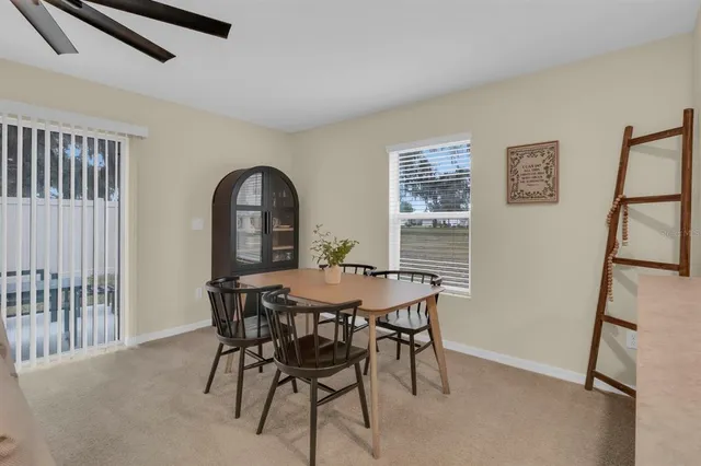 a kitchen with granite countertop white cabinets and stainless steel appliances