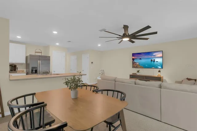 a kitchen with kitchen island a sink appliances and cabinets