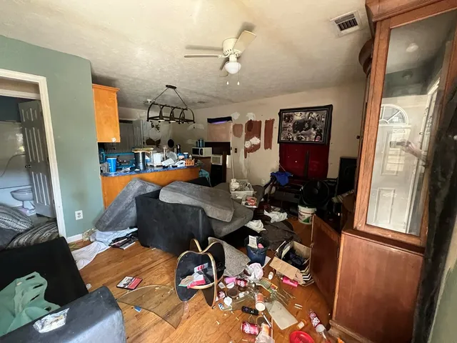 a living room with furniture and a window