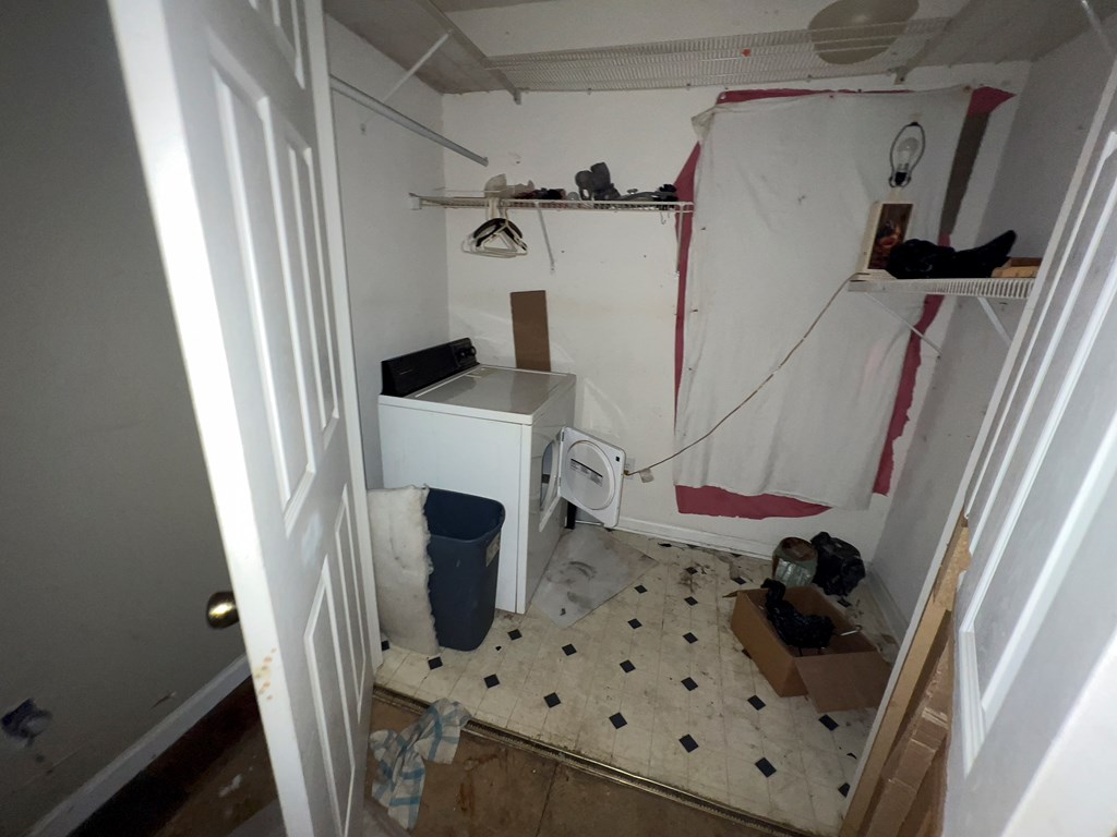 927 Vineville Street Columbus, GA 31904 - Photo 6 of 11 a view of a storage and utility room with washer and dryer