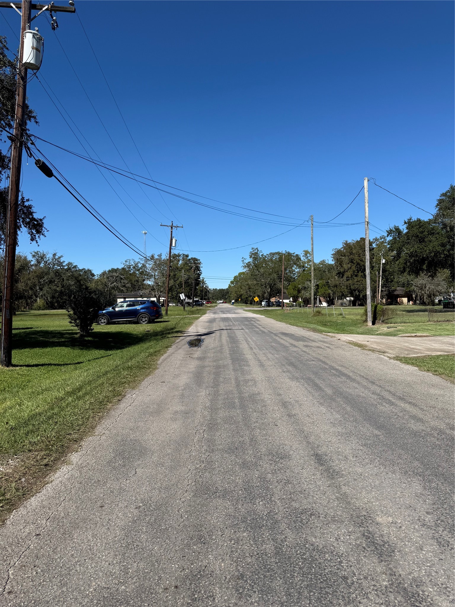 112 South Travis Street Sweeny, TX 77480 - Photo 3 of 4 a view of a street with a building