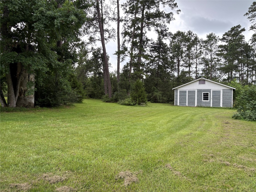 5152 Richardson Road East Livingston, TX 77351 - Photo 13 of 13 a front view of house with yard and green space