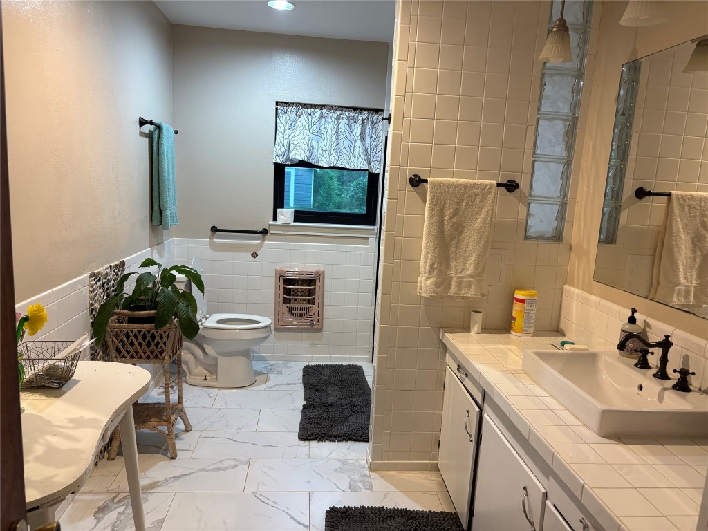 5152 Richardson Road East Livingston, TX 77351 - Photo 4 of 13 a bathroom with a sink toilet and shower