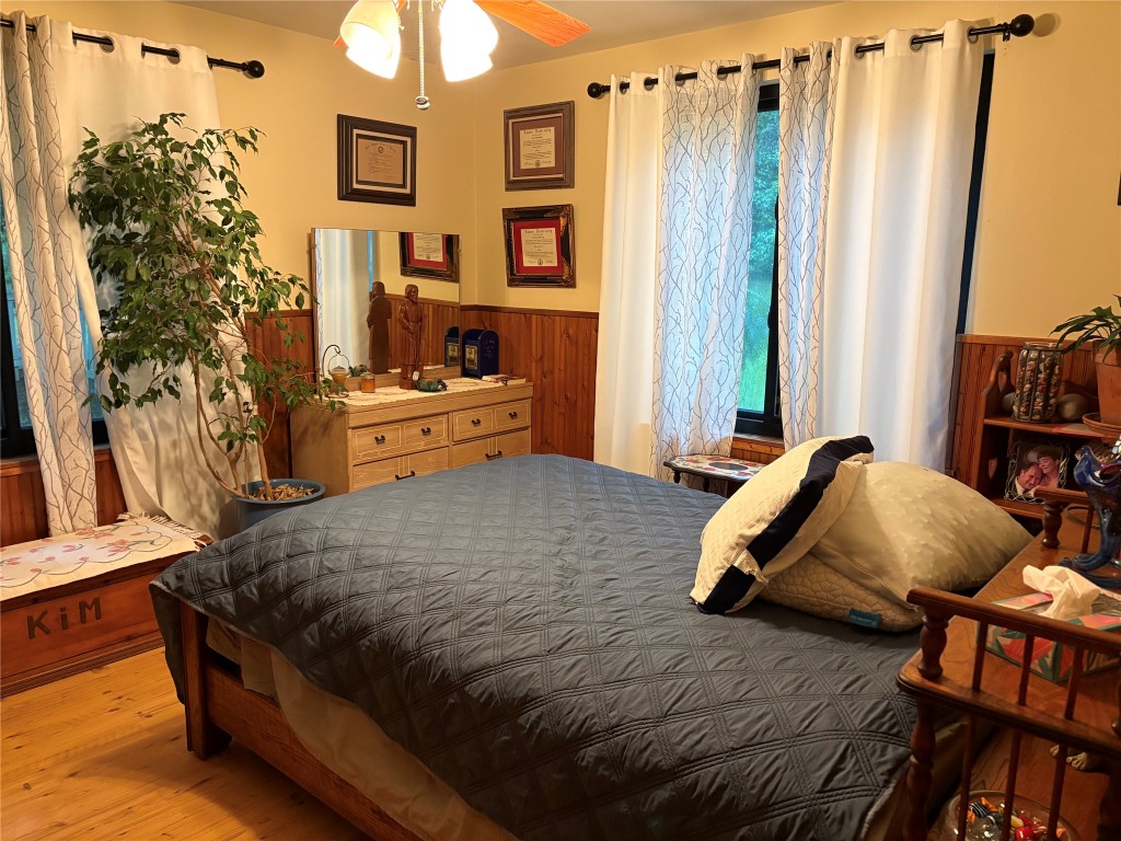 5152 Richardson Road East Livingston, TX 77351 - Photo 9 of 13 a bedroom with a bed and a flat tv screen on dresser