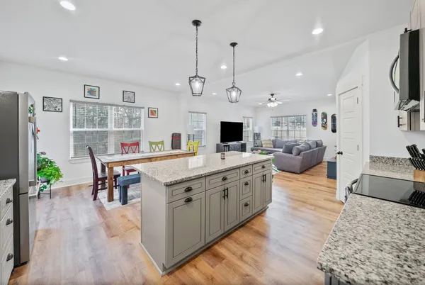 a utility room with cabinets washer and dryer