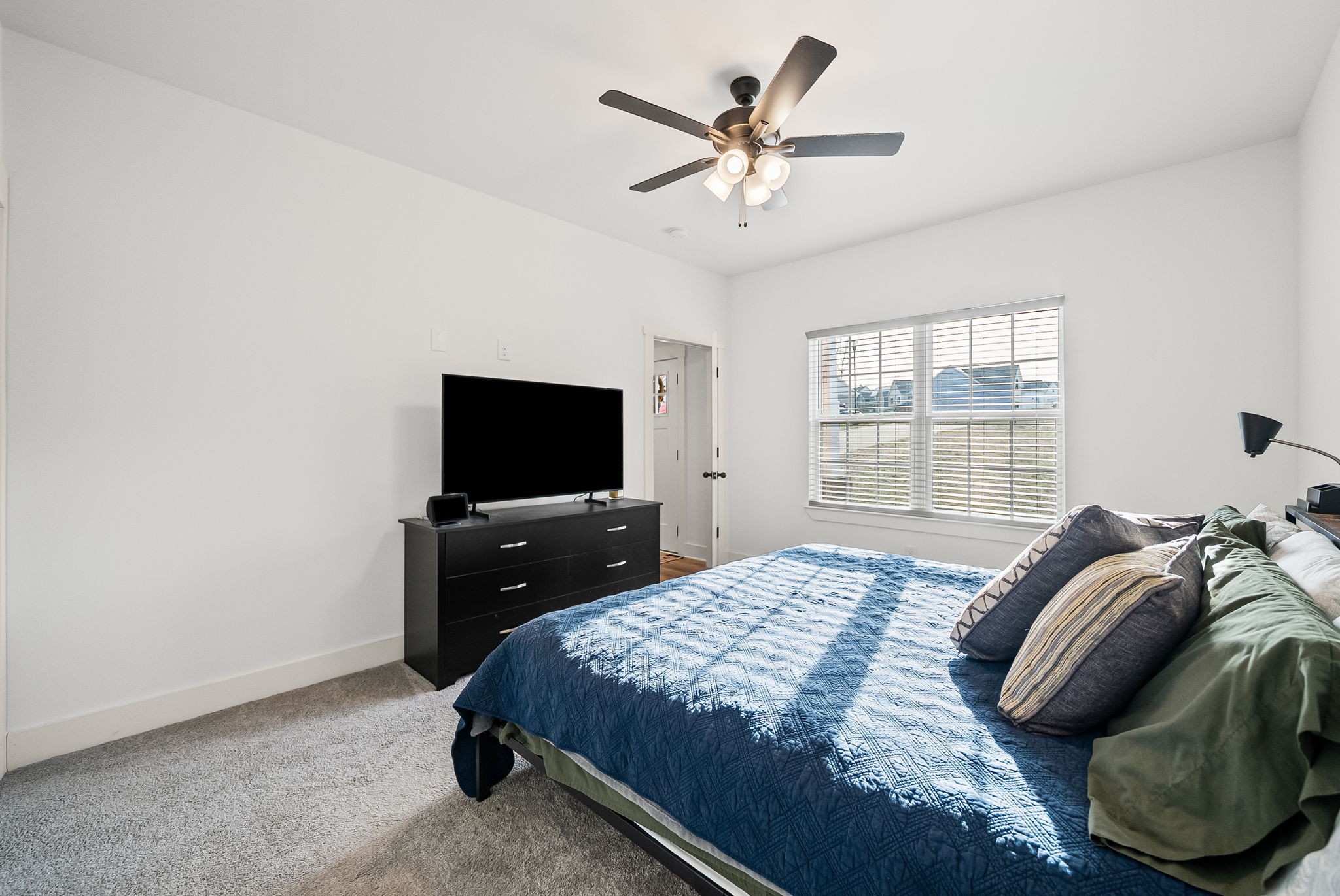 1160 Jonathan Lane Springfield, TN 37172 - Photo 16 of 26 a bedroom with a bed and a flat screen tv