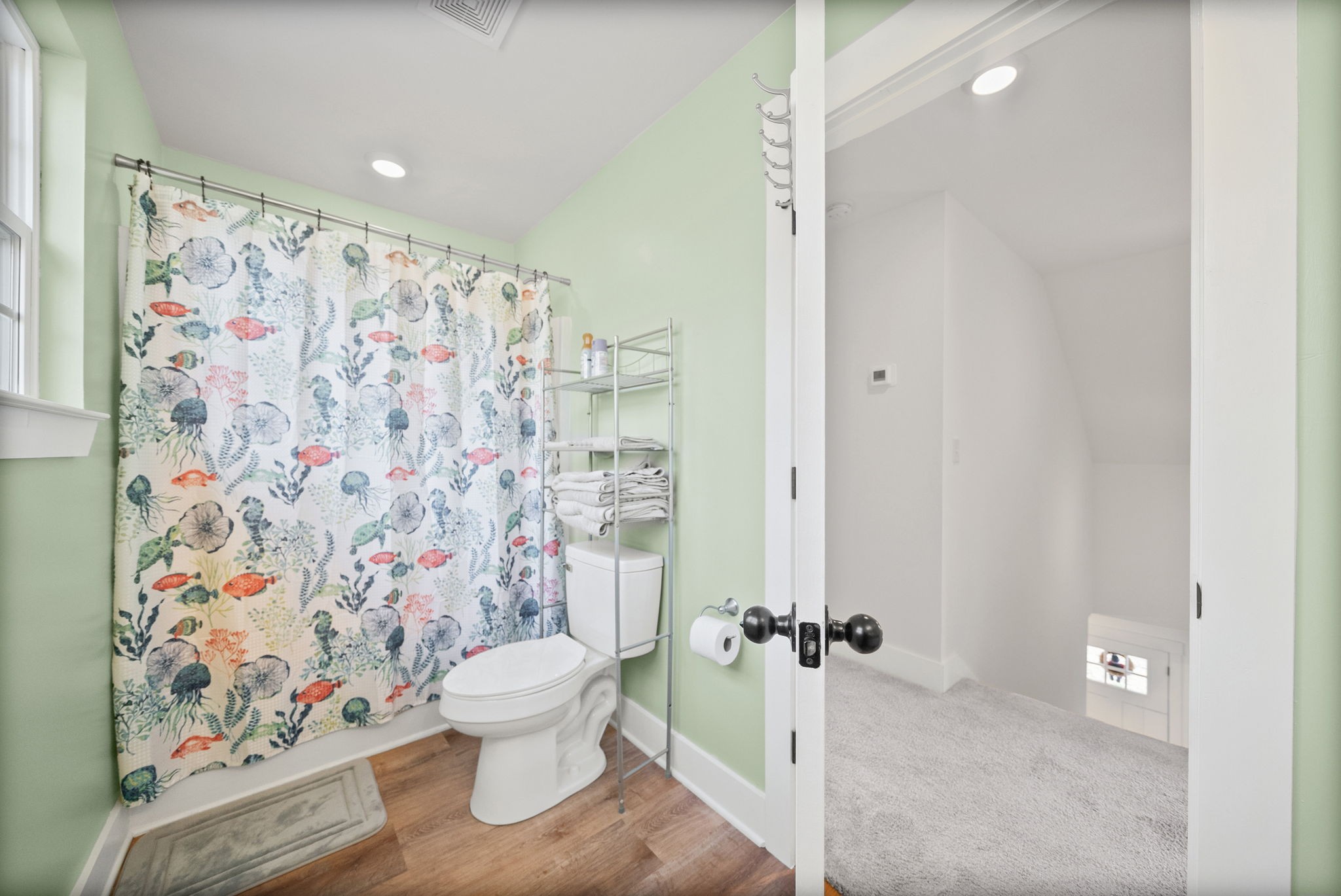 1160 Jonathan Lane Springfield, TN 37172 - Photo 21 of 26 a bathroom with a toilet and a shower curtain
