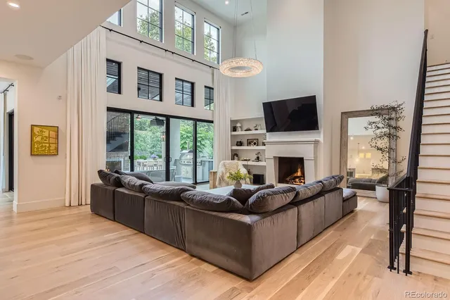 a living room with furniture or kitchen view and a wooden floor
