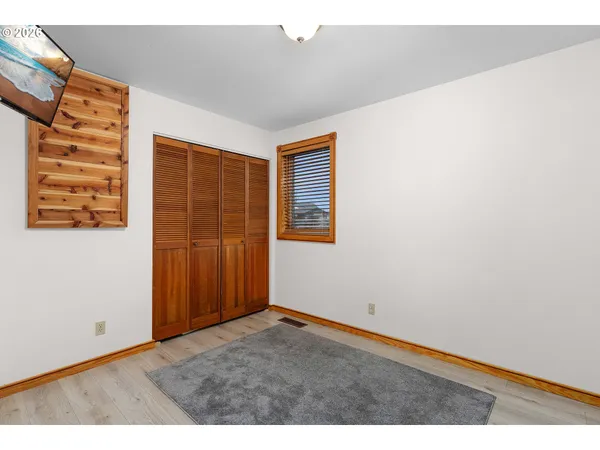 a view of a livingroom with wooden floor