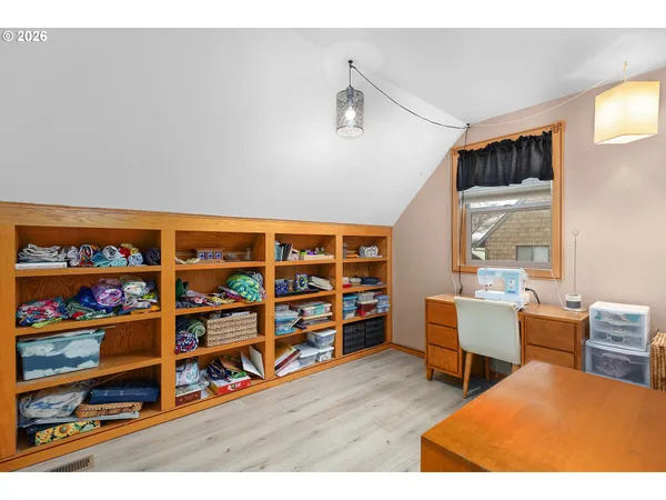 a room with toys and wooden floor