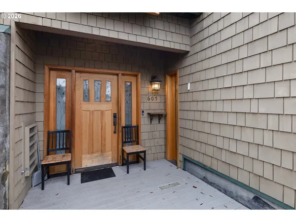 a view of a dining room with furniture and a window