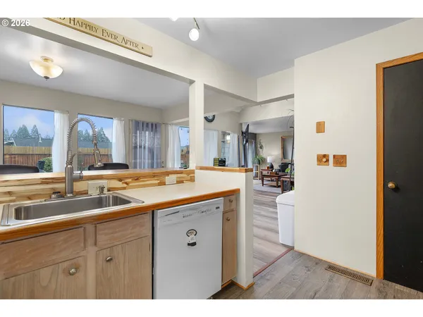 a kitchen with a sink stove and microwave