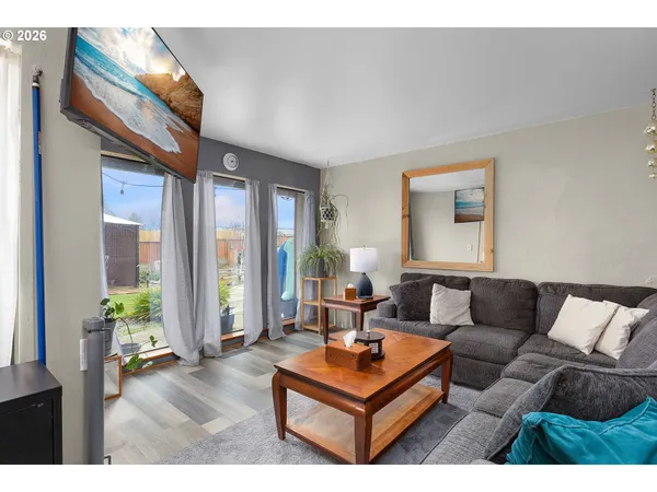 a living room with furniture and a rug